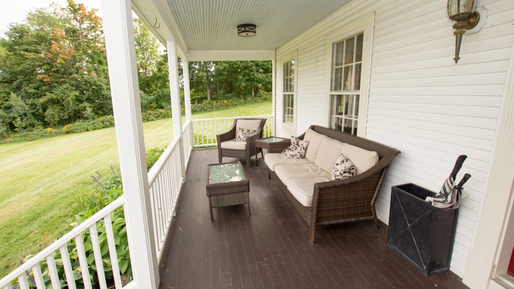 Farmhouse front porch.  Perfect for sipping coffee before the big day!