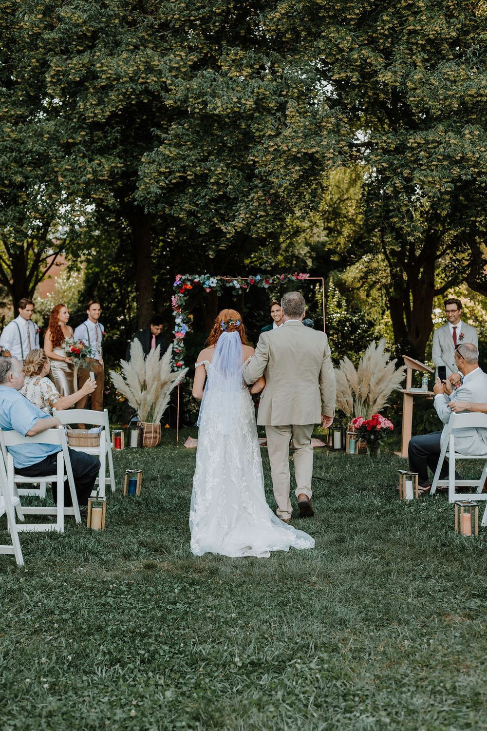 Wedding ceremony on the wedding lawn. Photo by Maddie Lilly Photography