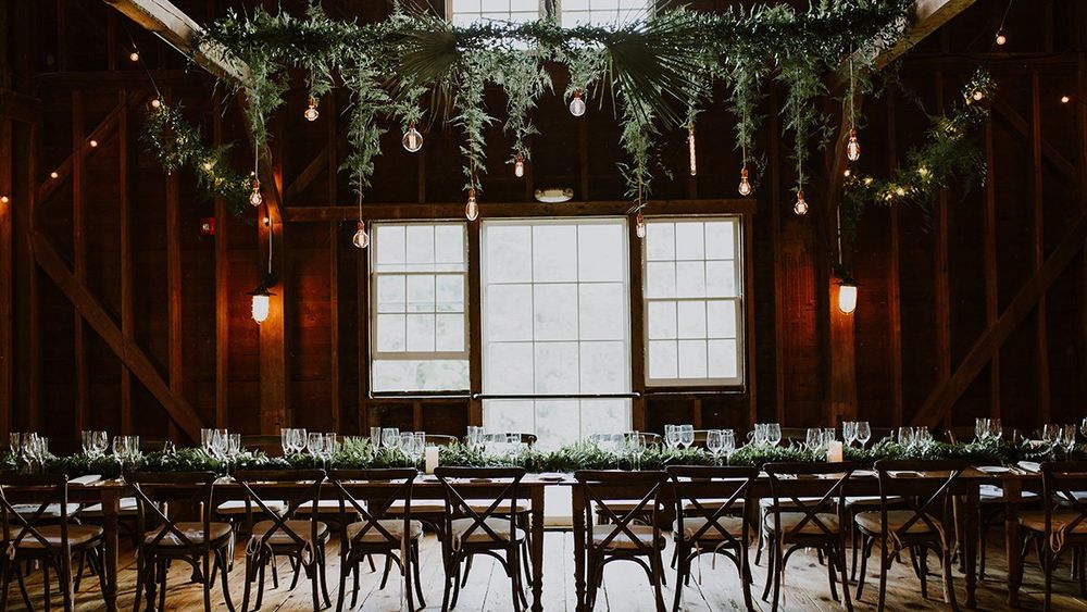 Simple elegance was the time of this family style table arrangement for lovely fall wedding at the Farm.  Photo by XXXX.