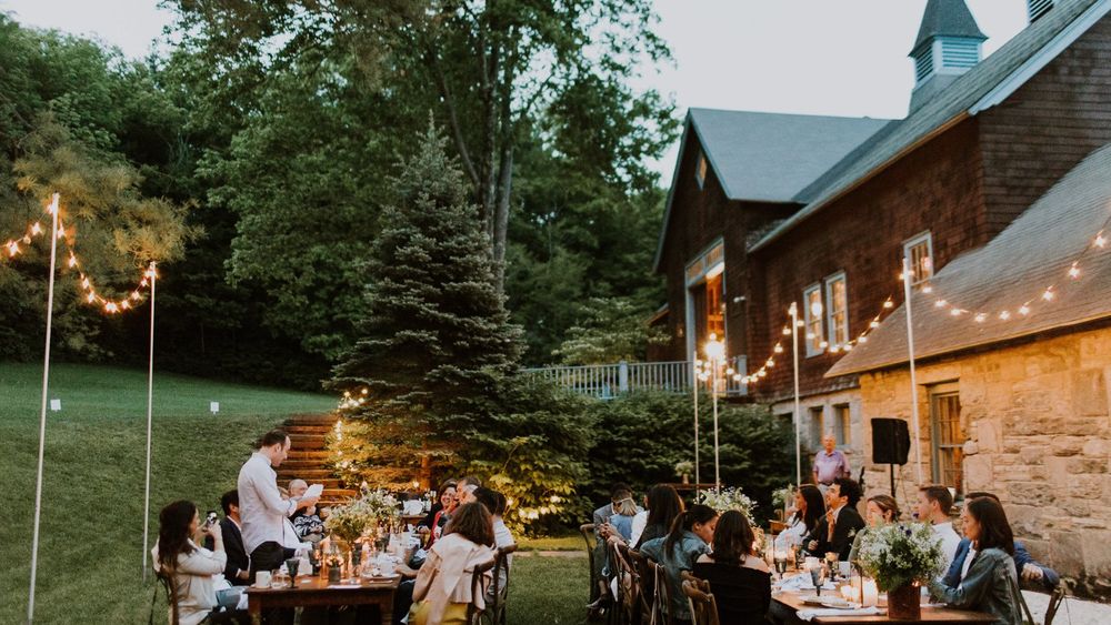 The outdoor lawn adjacent to the Barn creates a lovely space for an intimate rehearsal dinner for your family and closest friends.  Photo by